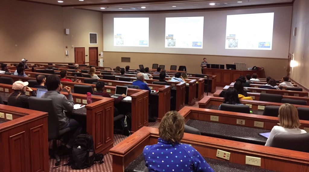 Photo of seminar speaker in auditorium